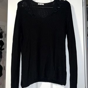 Medium black sweater with cutouts